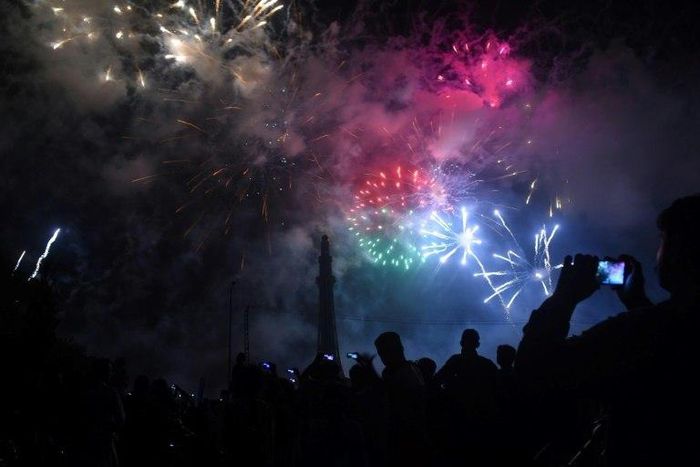 People watch fireworks in Lahore to celebrate Pakistan's Independence Day on the 70th anniversary of the country's creation