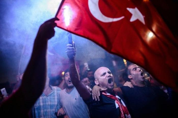 Supporters of President Recep Tayyip Erdogan rally in Istanbul's Taksim Square in July 2016 following a failed coup