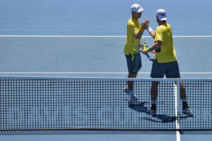 Australia's Sam Groth (R) and Jon Peers celebrate beating Jiri Vesely and Jan Satral of the Czech Republic in their Davis Cup World Group doubles rubber, at Kooyong in Melbourne, on February 4, 2017