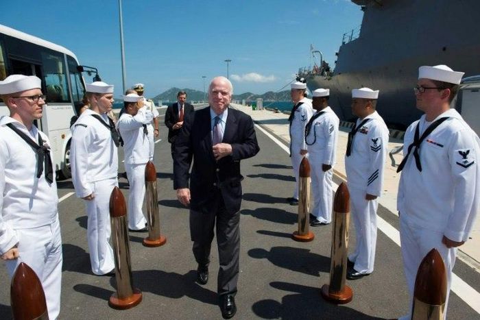 US Senator John McCain (C) visits the forward-deployed Arleigh Burke-class guided-missile destroyer USS John S. McCain docked at Cam Ranh International Port in Vietnam's central province of Khanh Hoa
