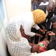 Senate President, Bukola Saraki vaccinates a child at the National Assembly clinic in Abuja on Wednesday, April 26, 2017.