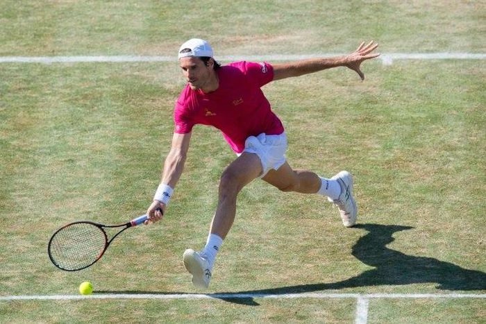 Germany's Tommy Haas returns the ball to Switzerland's Roger Federer in their round of sixteen match at the Mercedes Cup tennis tournament in Stuttgart June 14, 2017