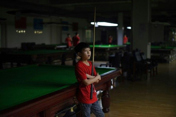 Students at the Beijing snooker school -- the first of its kind in China -- practise snooker eight hours a day in the hopes of following in the footsteps of their idol Ding Junhui.