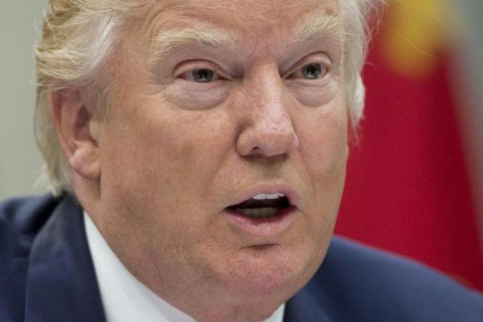 US President Donald Trump signed an order -- which temporarily freezes new visas for Syrians, Iranians, Libyans, Somalis, Yemenis and Sudanese citizens -- behind closed doors