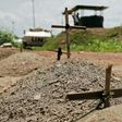 Makeshift graves are seen at the UN House for internally displaced persons in Juba on July 22, 2016