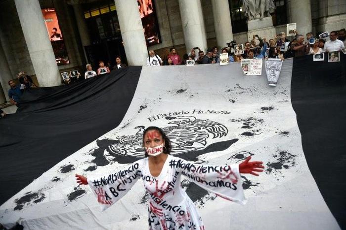 Journalists take part in a protest to mark one month since the murder of their colleague Javier Valdez, a noted expert on the country's drug cartels and AFP contributor, in Mexico City, on June 15, 2017