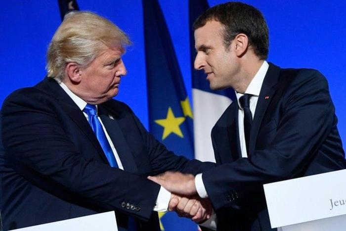 US President Donald Trump (L) and French President Emmanuel Macron avoided comment or criticism over Chinese Nobel Laureate Liu Xiaobo's death at a joint press conference