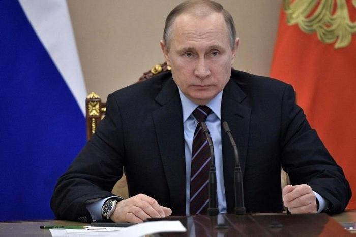 Russian President Vladimir Putin leads a meeting with members of the government on April 12, 2017 in Moscow