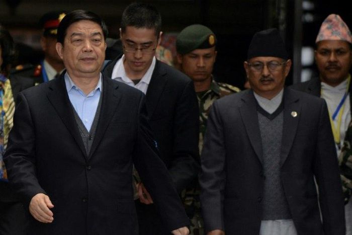 China's Defence Minister Chang Wanquan (L) is escorted by Nepalese officials after his arrival at Tribhuwan International Airport in Kathmandu on March 23, 2017