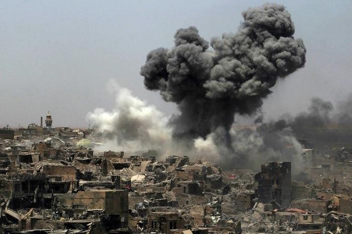 A picture taken on July 9, 2017, shows smoke billowing following an airstrike by US-led international coalition forces targeting Islamic State group in Mosul
