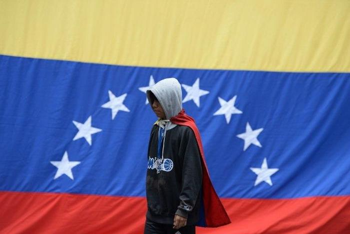 Venezuelan opposition activists protest in Caracas on July 10, 2017, demonstrations that have persisted for almost four months and left nearly 100 people dead