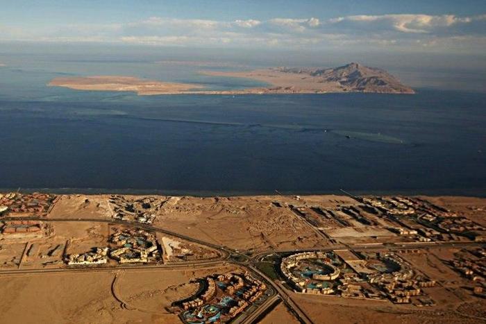The Red Sea islands of Tiran (foreground) and Sanafir (background) are seen in the Strait of Tiran between Egypt's Sinai Peninsula and Saudi Arabia