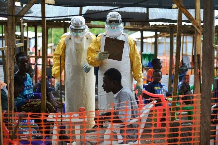 Medical workers monitoring patients at the height of the Ebola crisis in 2014