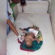 The eight-month-old baby pictured with the knife sticking out of his stomach