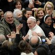 Pope Francis shakes hands during an audience at the Vatican with people struck by the Italian earthquakes on January 5, 2017
