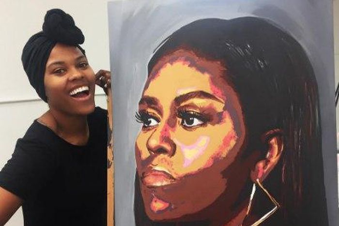 Artist beside the Michelle Obama portrait
