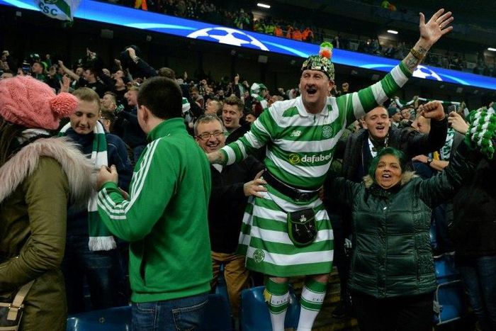 Celtic fans celebrate following a UEFA Champions League match in Manchester, in 2016