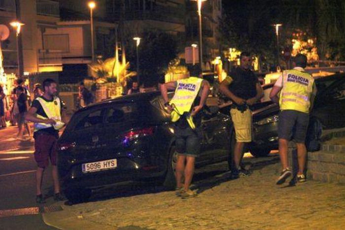 Police inspect the vehicle used in the Cambrils attack