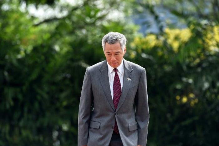 Singapore Prime Minister Lee Hsien Loong stands at an event at the Istana presidential palace in Singapore