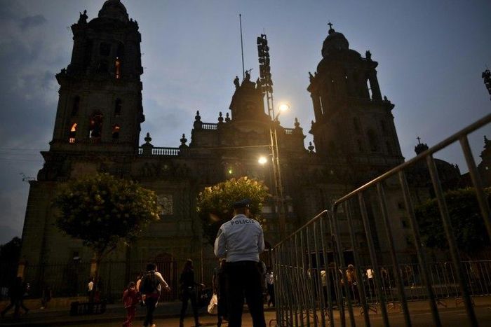 A priest is stabbed in the neck by a man identifying himself as a US national at the cathedral on El Zocalo square in Mexico City