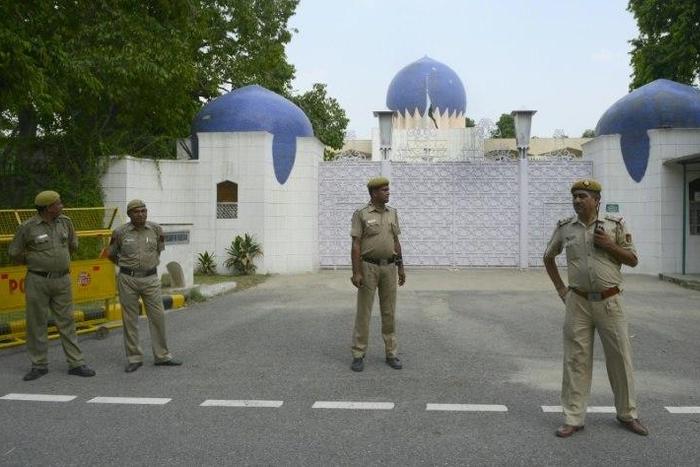Indian policemen stand guard outside the High Commission for Pakistan in New Delhi