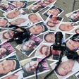 Pictures of journalists recently murdered in different Mexican states lay on the ground at Independence Angel square during a protest by journalists in Mexico City, on May 16, 2017