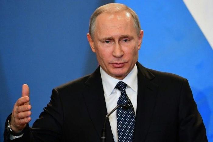 Critics said the law signed by Russian President Vladimir Putin, seen February 2, 2017, would exacerbate the already-widespread problem of domestic abuse of women by making it even harder for them to get help through the legal system