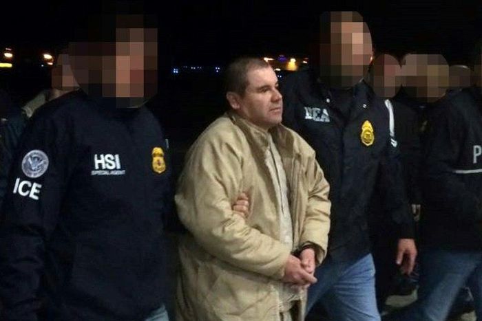 Joaquin Guzman Loera aka "El Chapo" (C) is escorted in Ciudad Juarez by the Mexican police as he is extradited to the United States