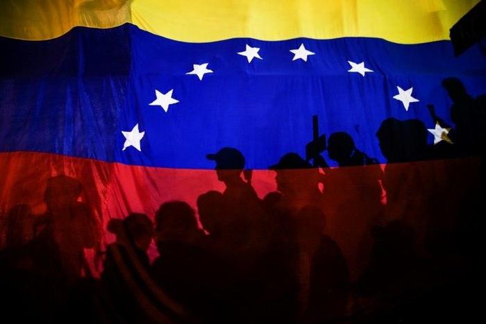 Opposition activists participate in demonstrations against the government of Venezuelan President Nicolas Maduro in Caracas in May 2017.