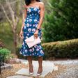Titilola Sogunro sports a floral bandeau with faux wrap details