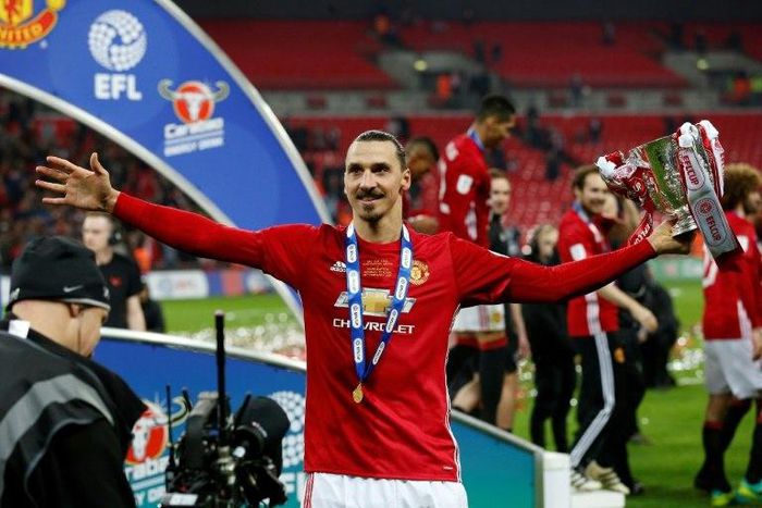 Manchester United's Zlatan Ibrahimovic celebrates with the trophy on the pitch after their victory in the English League Cup final match against Southampton at Wembley stadium in London on February 26, 2017