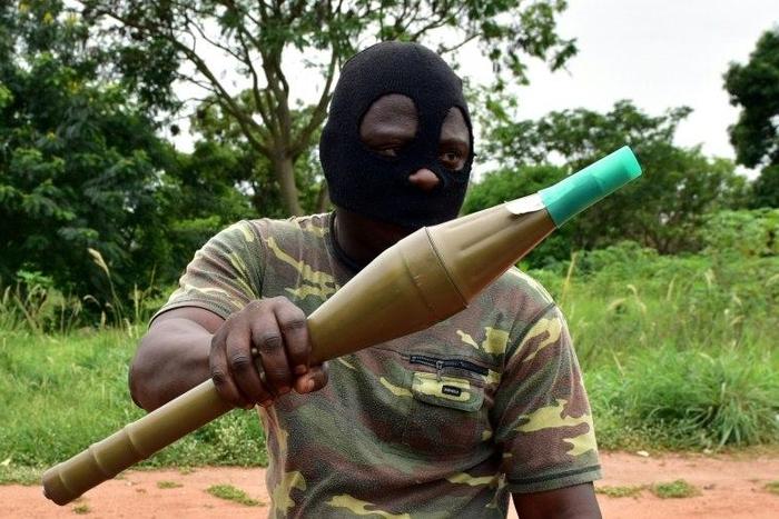 A mutinous soldier holds an RPG rocket launcher inside a military camp in Ivory Coast's second city Bouake, where the rebellion first erupted in January