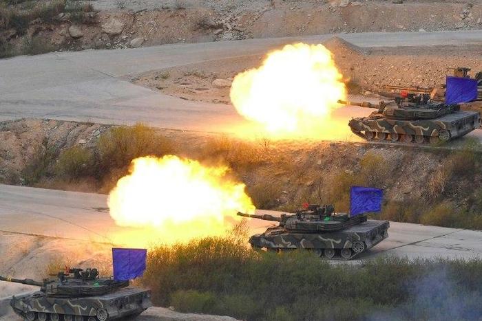 South Korean K1A2 tanks fire live rounds during a joint live firing drill between South Korea and the US at the Seungjin Fire Training Field in Pocheon on April 26, 2017