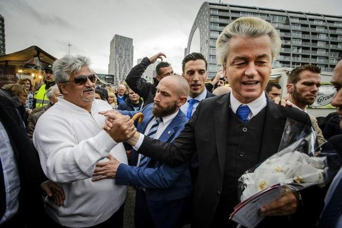 Dutch right-wing politician Geert Wilders (2nd R) of the Freedom Party (PVV) shakes hands with supporters during a protest against emergency accommodation for refugees in Rotterdam, in 2015