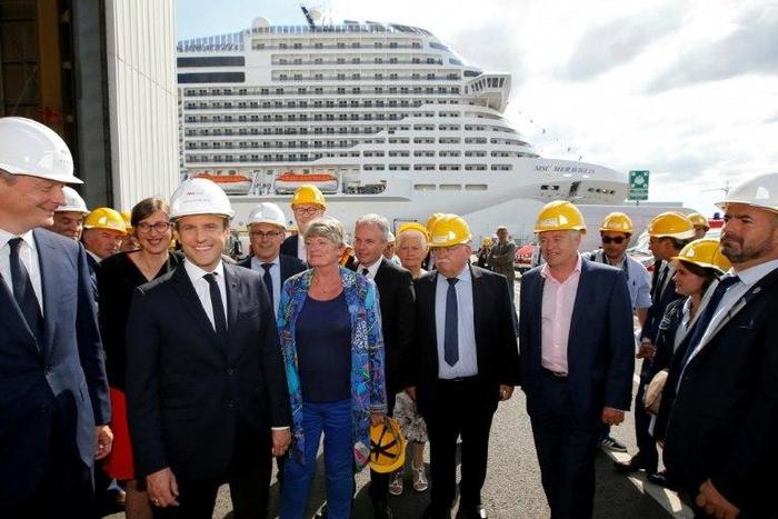 French Economy Minister Bruno Le Maire (L), French President Emmanuel Macron (2ndL), attend the delivery ceremony of the MSC Meraviglia cruise ship on May 31, 2017 at the STX shipyard of Saint-Nazaire, western France