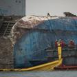 Workers take part in the Sewol ferry salvage operation off the coast of South Korea's southern island of Jindo on March 24, 2017