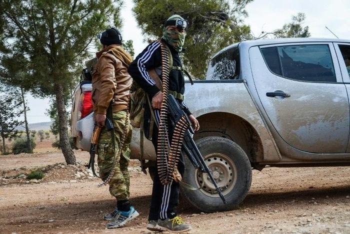 Two fighters from the Free Syrian Army stand guard on February 4, 2017 near the town of Bizaah northeast of the city of Al-Bab where Islamic State is reportedly 'besieged'