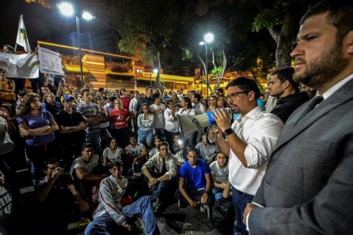 The first vice president of Venezuela's National Assembly, Freddy Guevara addresses marchers paying tribute to student Juan Pablo Pernalete, killed on April 26 by the impact of a gas grenade during a protest, in Caracas, on April 29, 2017