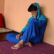 An Afghan boy, who was held as a child sex slave, sits at a restaurant in a unidentified location in Afghanistan