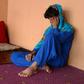 An Afghan boy, who was held as a child sex slave, sits at a restaurant in a unidentified location in Afghanistan
