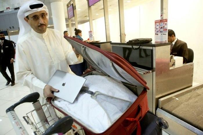 A ban on laptops in cabins frustrates travellers and will eat into airlines' profits, experts say