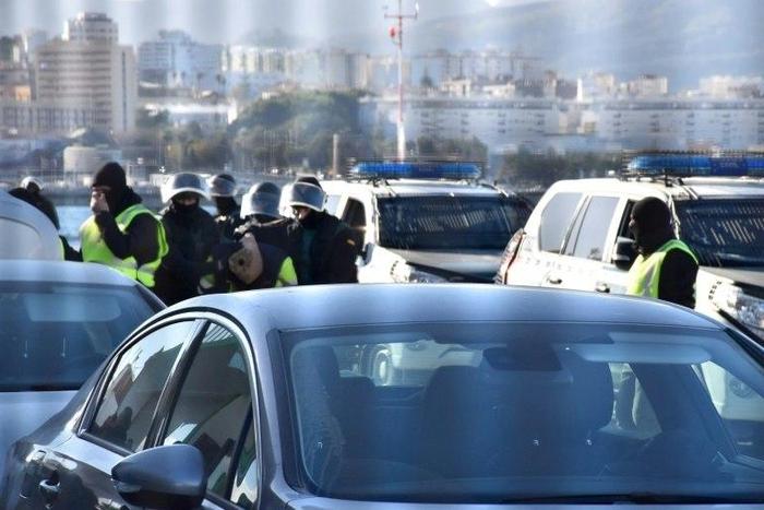 A suspected jihadist is escorted by Spanish Guardia Civil policemen after being arrested, in Spain's North African enclave of Ceuta, on January 13, 2017