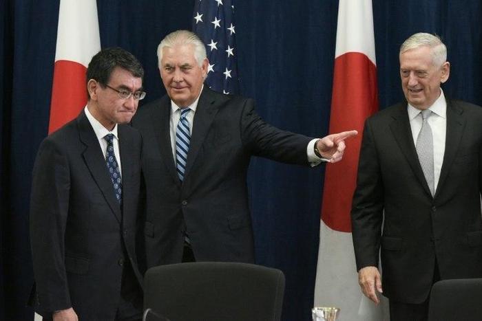 US Defense Secretary James Mattis (R) watches as US Secretary of State Rex Tillerson (C) shows the way to Japan's Foreign Minister Taro Kono ahead of the start of the US-Japan Security talks centered on North Korea