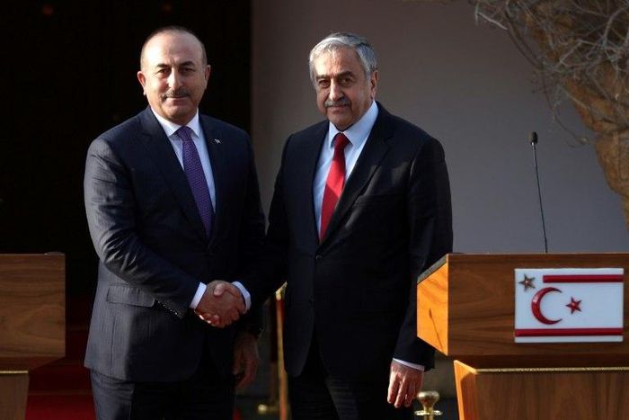 Turkish Cypriot leader Mustafa Akinci (right) holds a press conference with Turkish Foreign Minister Mevlut Cavusoglu after a meeting in the self-proclaimed Turkish Republic of Northern Cyprus (TRNC) on February 21, 2017
