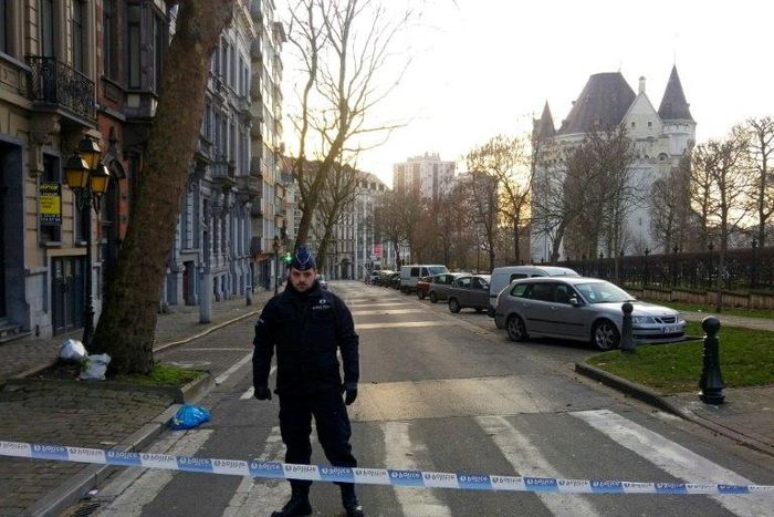 A police officer stands guard in Porte de Hal, Brussels, after a driver was arrested with gas cylinders in his vehicle on March 2, 2017