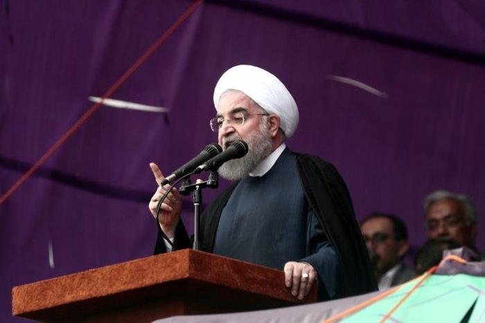 The decision not to renew sanctions on Iran's nuclear program may boost Iranian President Hassan Rouhani's re-election campaign