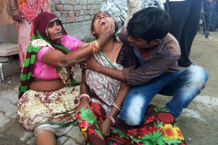 A woman cries after a wall collapsed during a wedding, killing at least 24 people, in Bharatpur, in India's Rajasthan state, on May 11, 2017
