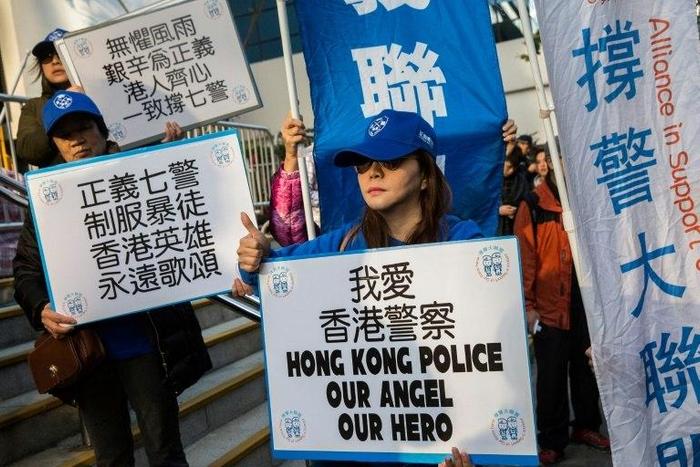 The trial of seven police officers found guilty of assaulting a pro-democracy activist draws groups of pro- and anti-police demonstrators