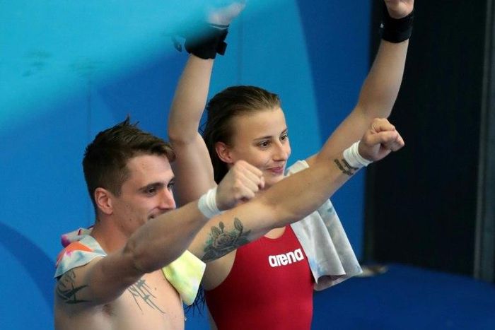 France's Laura Marino and France's Matthieu Rosset react after winning the 3m/10m team event during the diving competition at the 2017 FINA World Championships in Budapest, on July 18, 2017