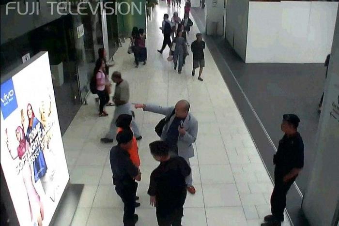 Kim Jong-Nam (C, in grey suit), half-brother of North Korea's leader Kim Jong-Un, was attacked with a lethal nerve agent at Kuala Lumpur's international airport in February